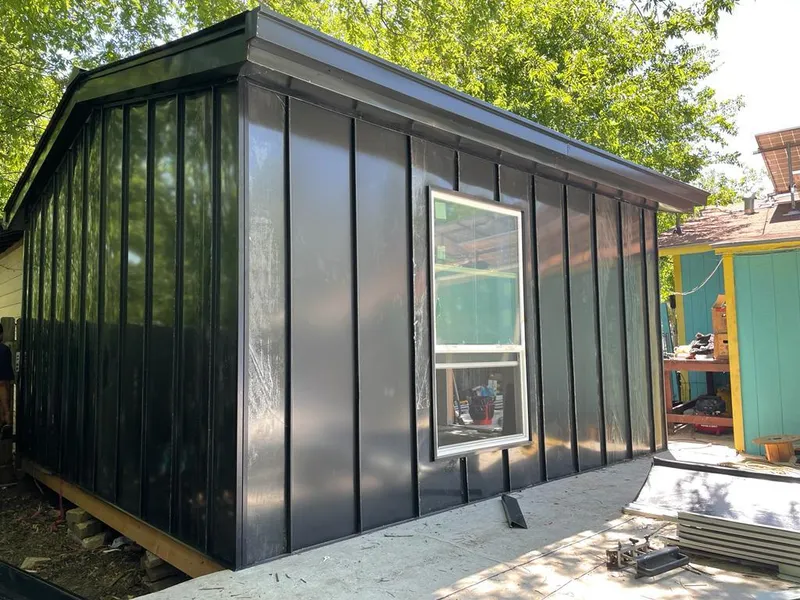 Black standing seam metal wall panels for Metal Roof Installation in Hewitt